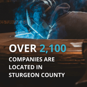 Welder works in the image, with overlayed text reading "over 2100 companies are located in Sturgeon County"