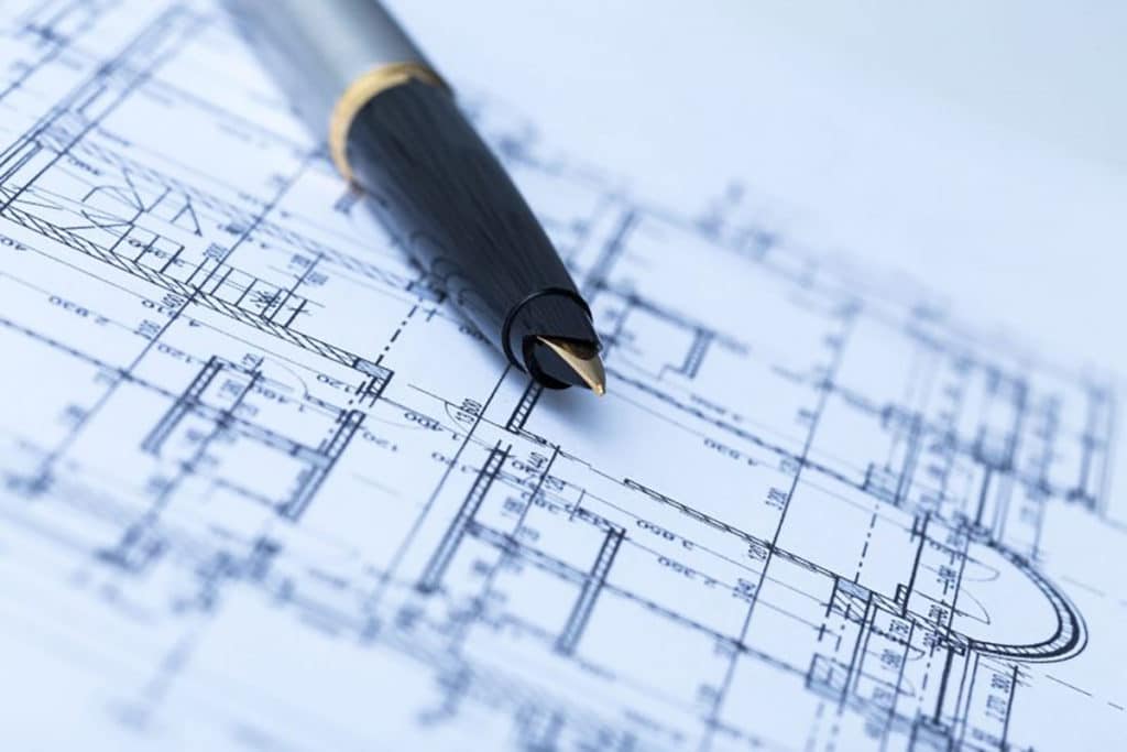 Pen laying on top of a blueprint