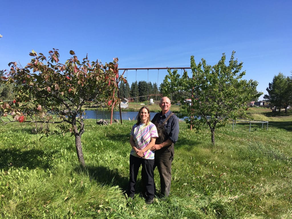 Jo-Anne and Ward Middleton pose on their family farm upon winning the 2023 Excellence in Agriculture Award.