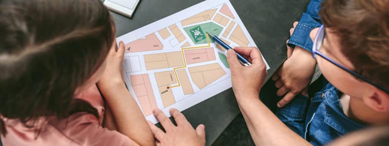 Top view of a family building a home fire escape plan